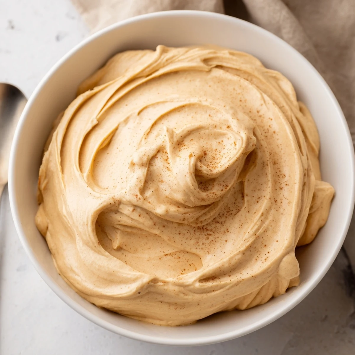 Creamy Spiced Pumpkin Coffee Whip Dip served with apple slices and cookies.  