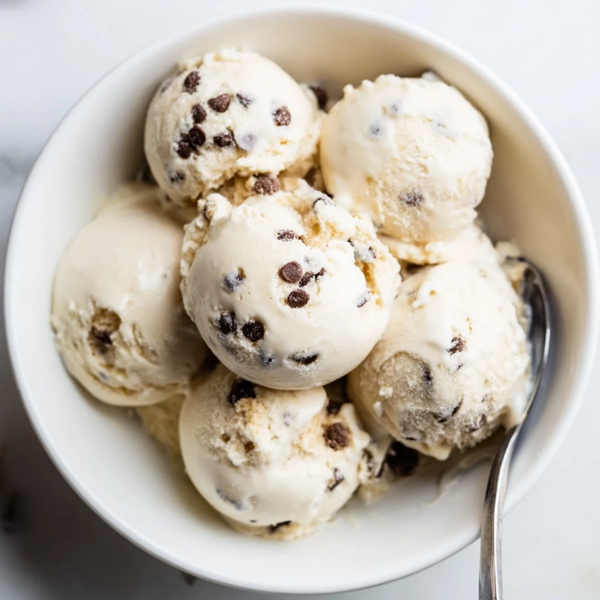 Refreshing cottage cheese ice cream with chunks of cookie dough, perfect for summer days.  
