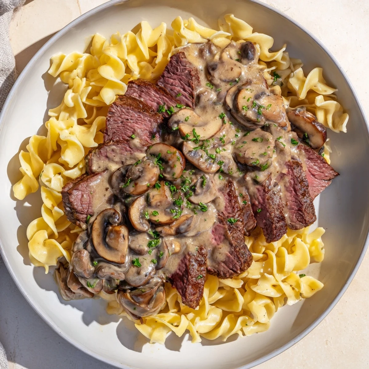 This comforting plate of Creamy Mushroom Beef Stroganoff showcases the perfect combination of textures and flavors.