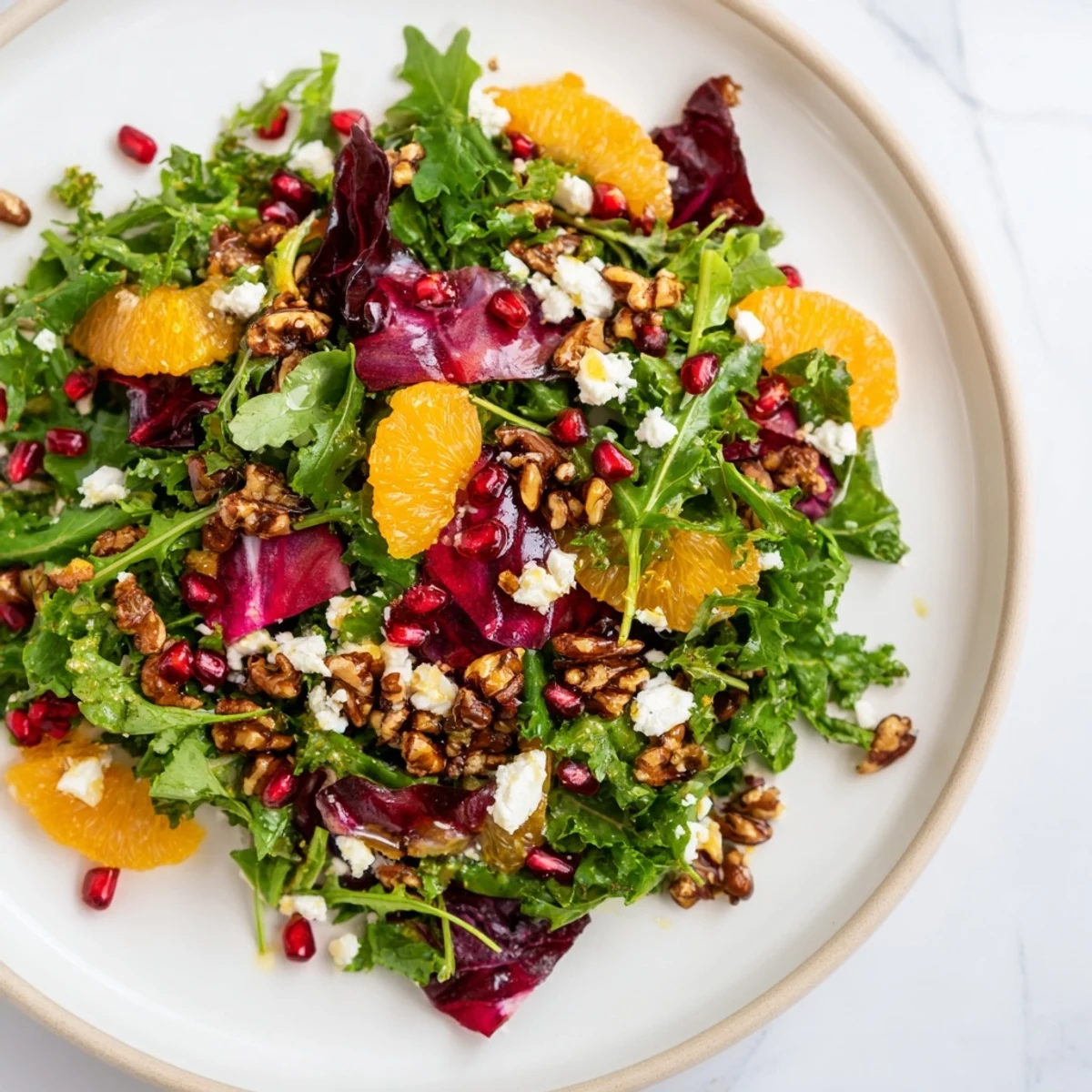 This Winter Greens Salad, laden with pomegranate seeds and toasted nuts, is perfect for a light lunch.