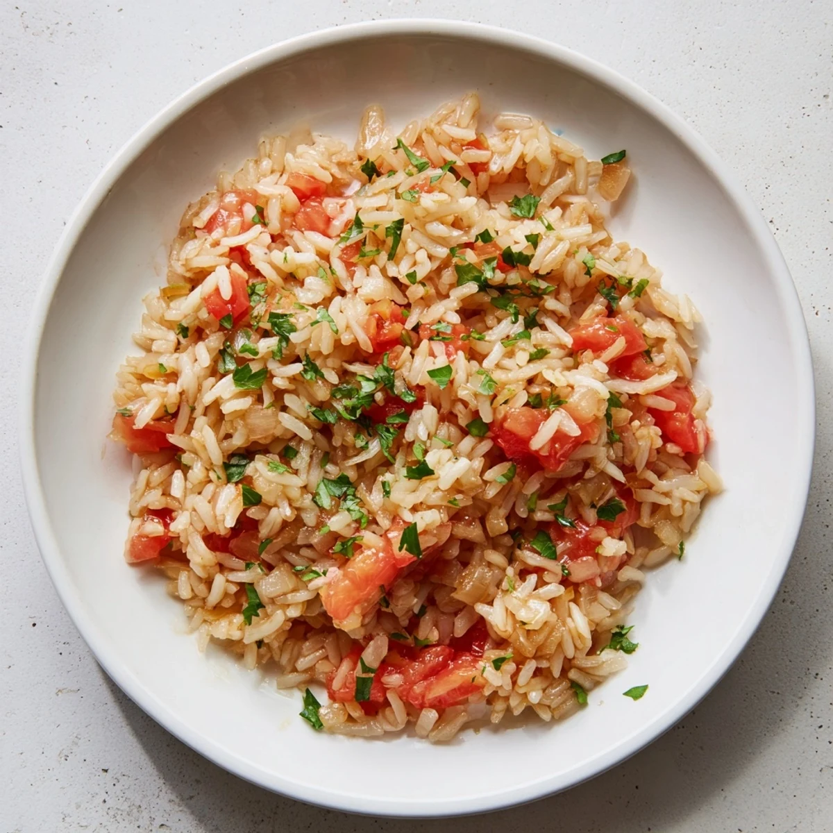 A comforting, vegetarian Tomato-Rice Skillet Dinner, ready in under an hour, served hot.