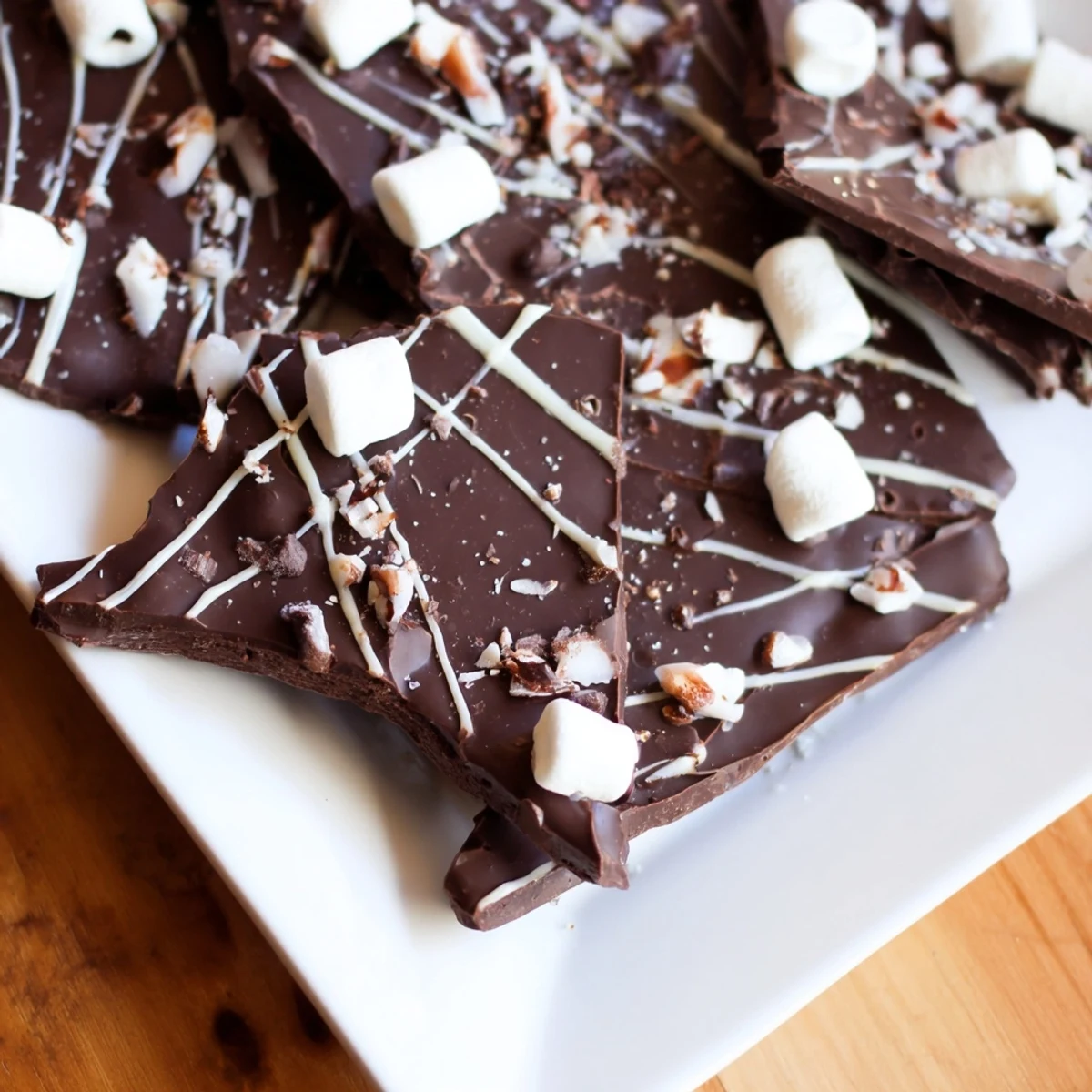 Hot Chocolate Bomb Bark, a festive dessert with marshmallows and chocolate sprinkles, ready to enjoy.
