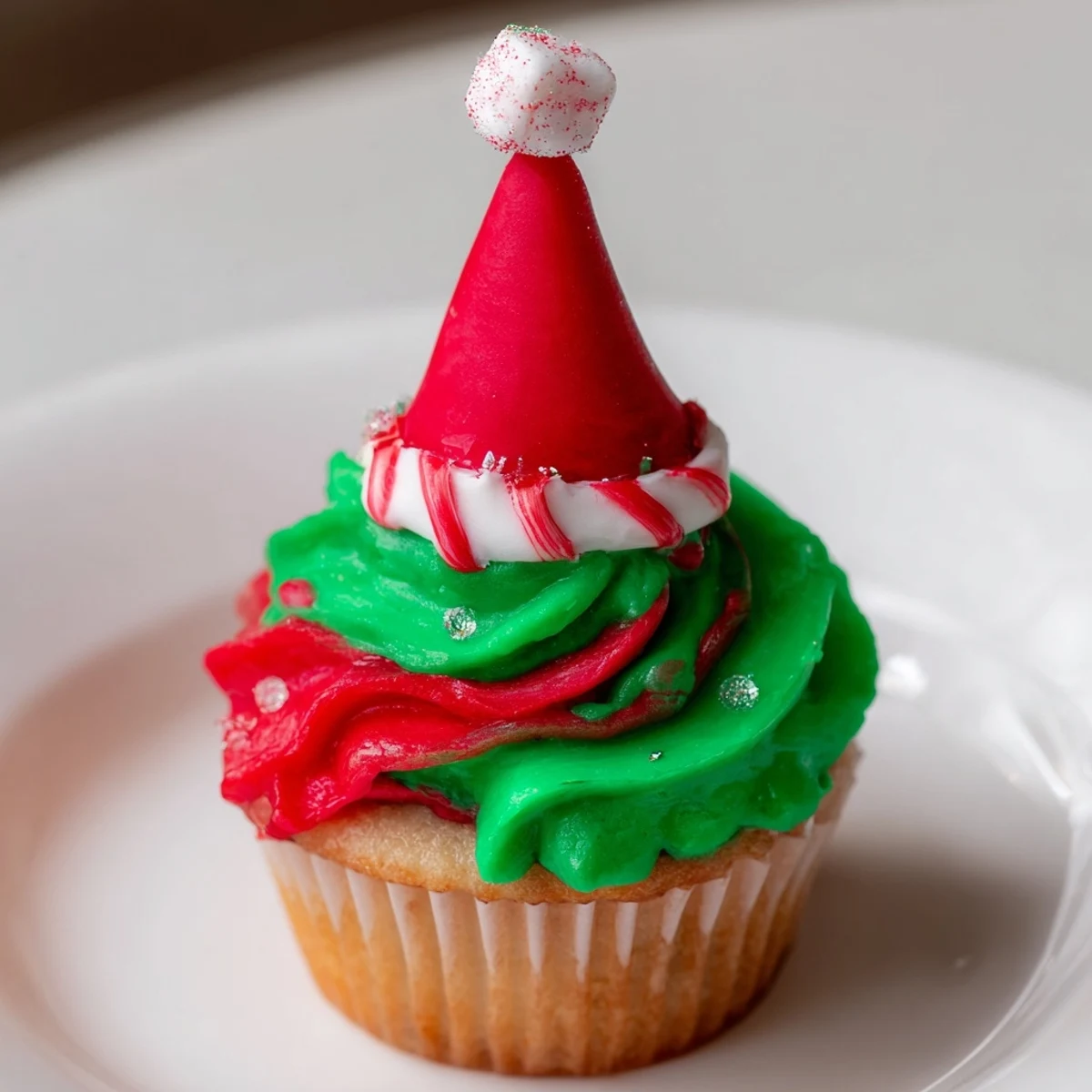 Golden frosted Elf Hat Cupcake Tower, festive and delightful, awaits at your holiday gathering.