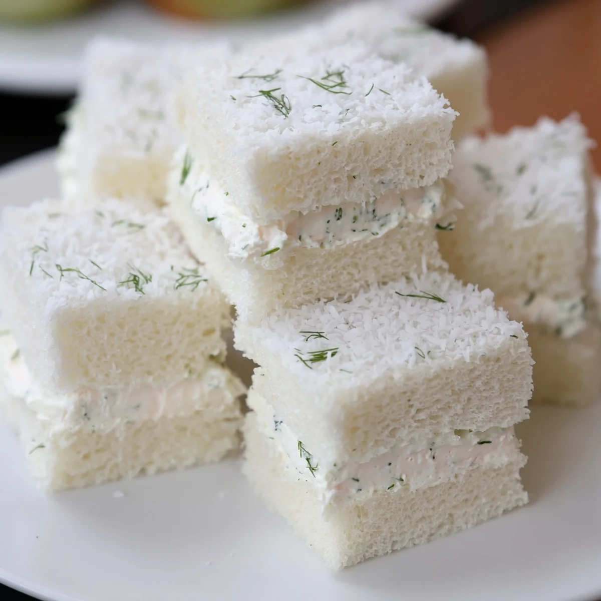 Perfect bite-sized Snowball Tea Sandwich Bites, featuring a delightful blend of flavors and textures.