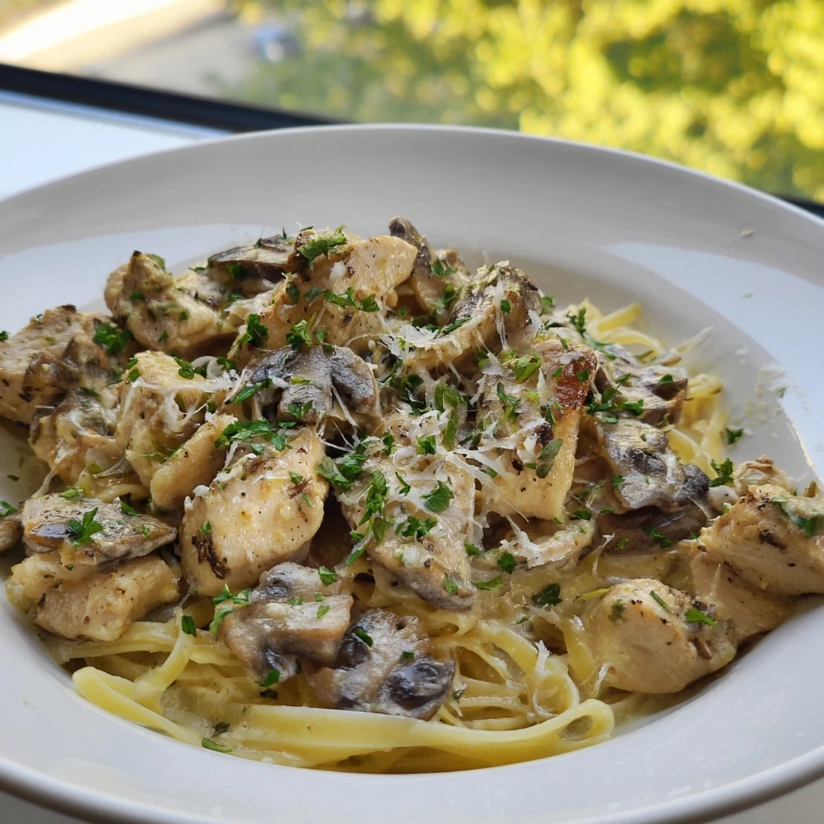 Creamy Mushroom Chicken Pasta: A close-up of a bowl filled with rich, creamy pasta and chicken.