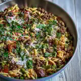 A hearty bowl of Comforting Ground Beef Orzo Dinner, featuring tender pasta, savory beef, and sweet bell peppers.