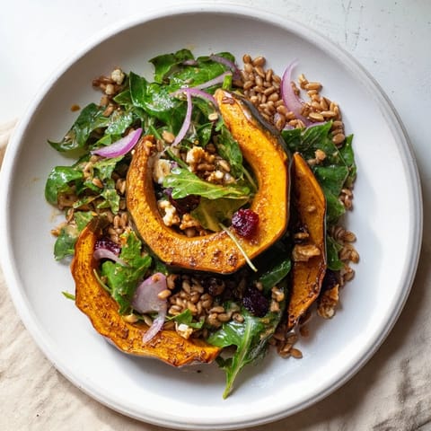 A colorful bowl filled with fluffy farro, and savory mustard greens making this Farro salad delicious.