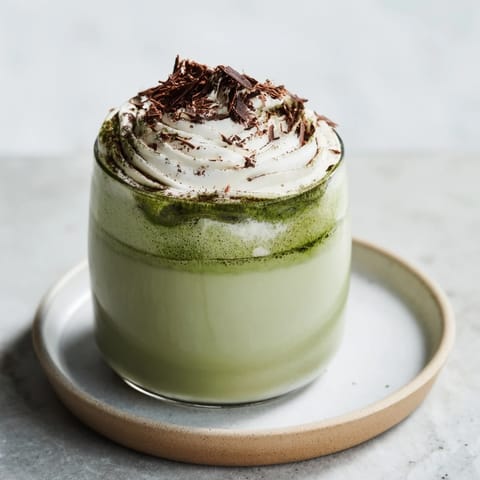 This creamy, flavorful Collagen Peppermint Mocha Matcha Latte showcases light green matcha and rich, dark chocolate hues.