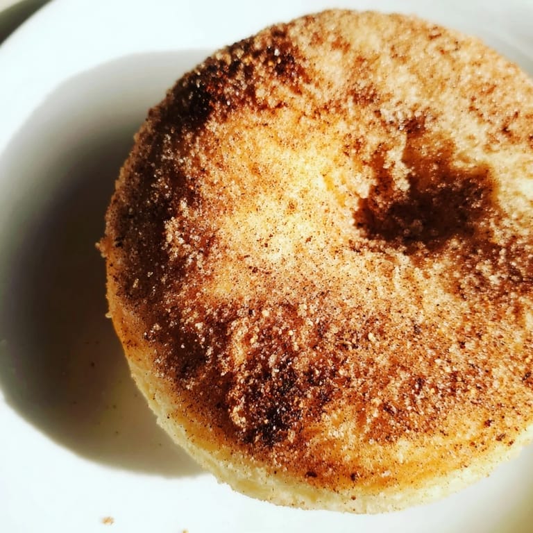 Close-up of fluffy cinnamon-sugar baked donuts, a simple, delicious treat ready to enjoy.